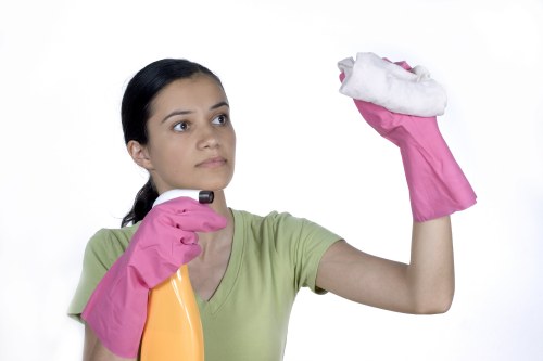 Staff handling cleaning products and protective gear safely